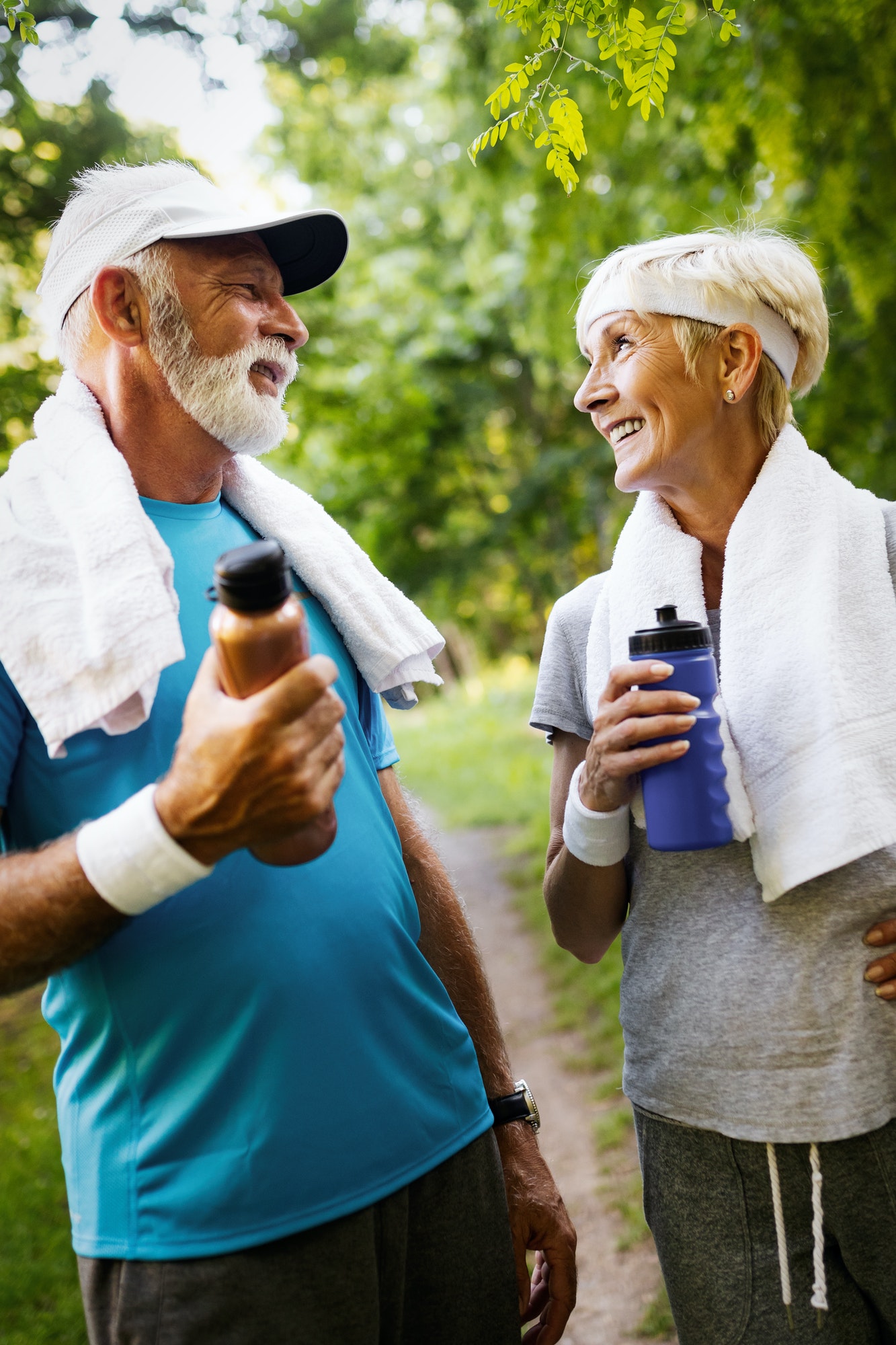 Happy senior couple staying fit by sport running